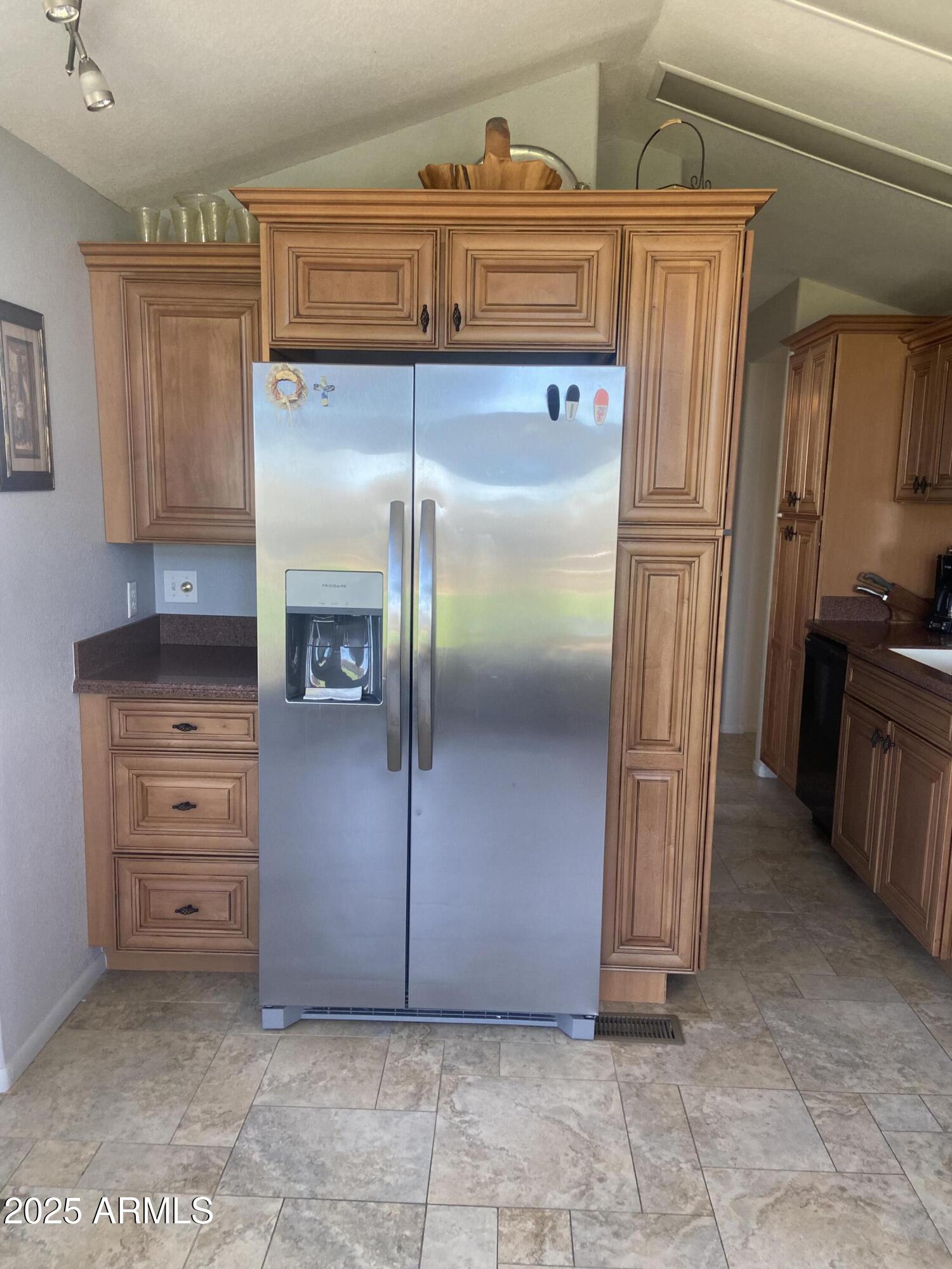 2239 West San Juan Circle Apache Junction, AZ 85119 - Photo 17 of 37 a kitchen with refrigerator cabinets and stainless steel appliances