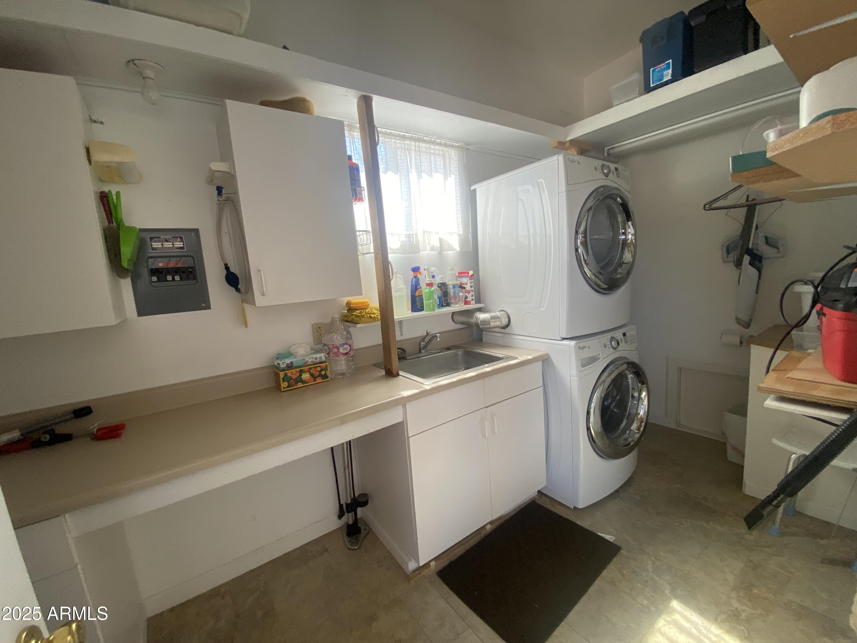 2239 West San Juan Circle Apache Junction, AZ 85119 - Photo 27 of 37 a utility room with sink dryer and washer