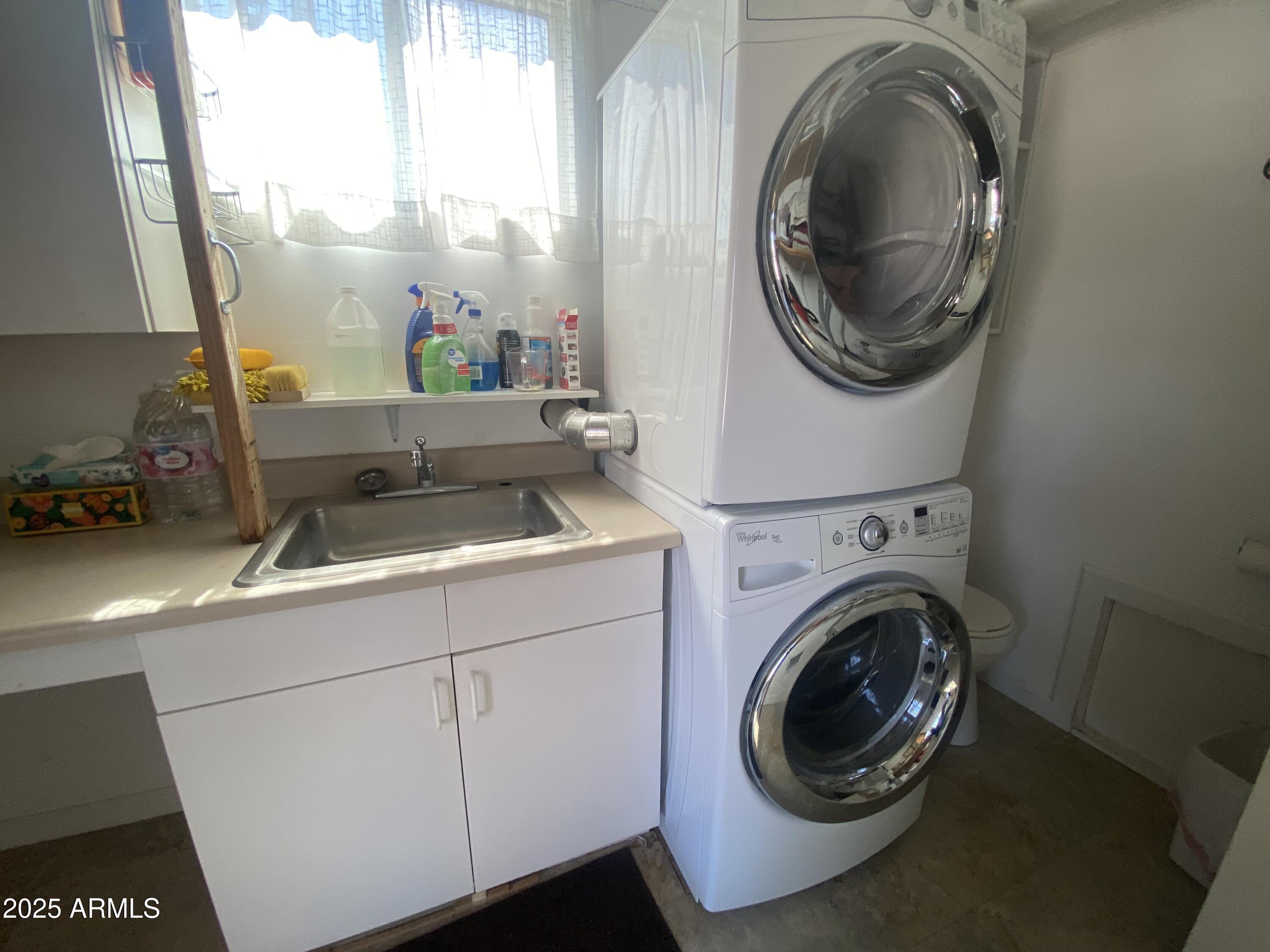 2239 West San Juan Circle Apache Junction, AZ 85119 - Photo 29 of 37 a utility room with dryer and washer