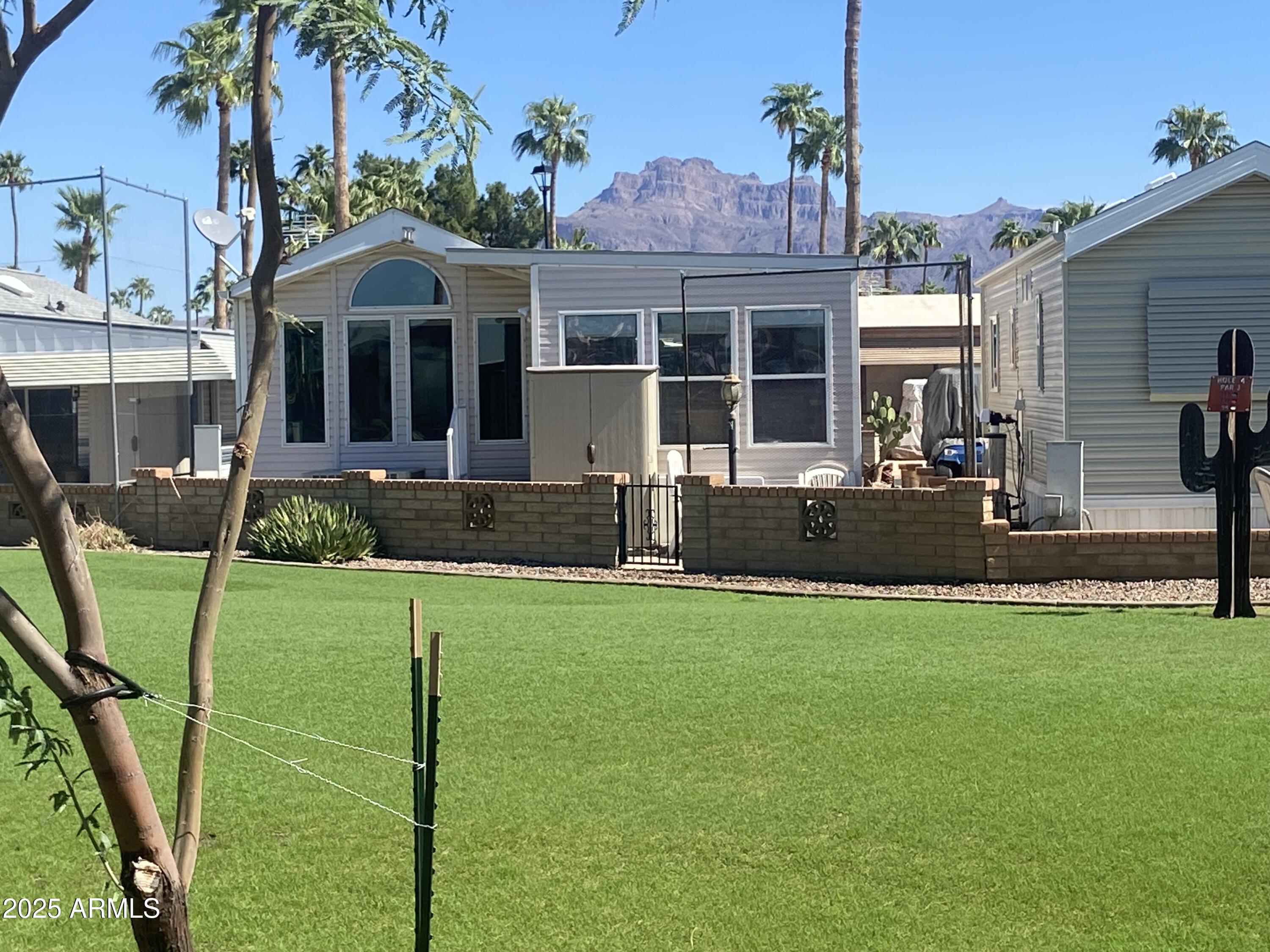 2239 West San Juan Circle Apache Junction, AZ 85119 - Photo 37 of 37 a front view of a house with garden