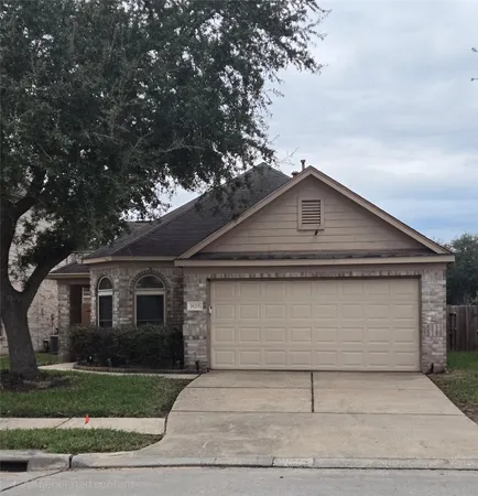 a front view of a house with garage