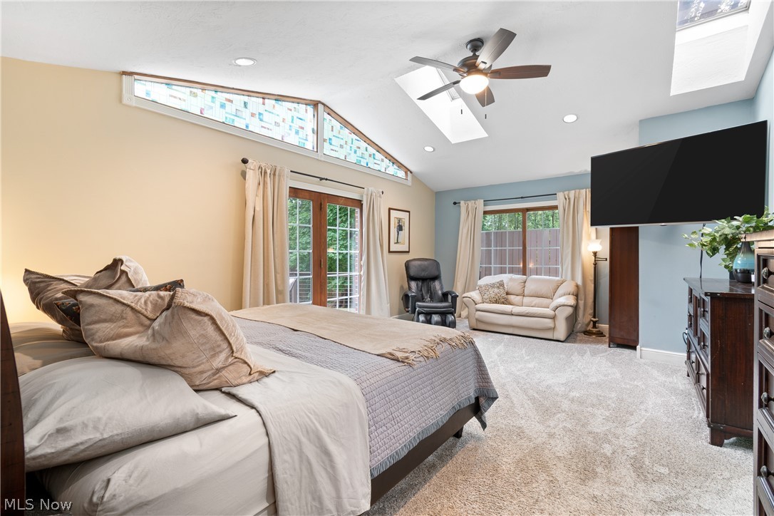 443 Merriman Road Akron, OH 44303 - Photo 19 of 44 Vaulted ceilings featuring two skylights, recessed lighting, and a ceiling fan