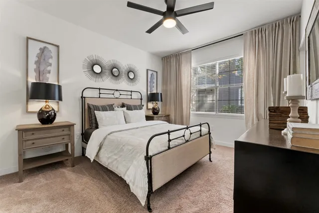 a bedroom with a bed and window