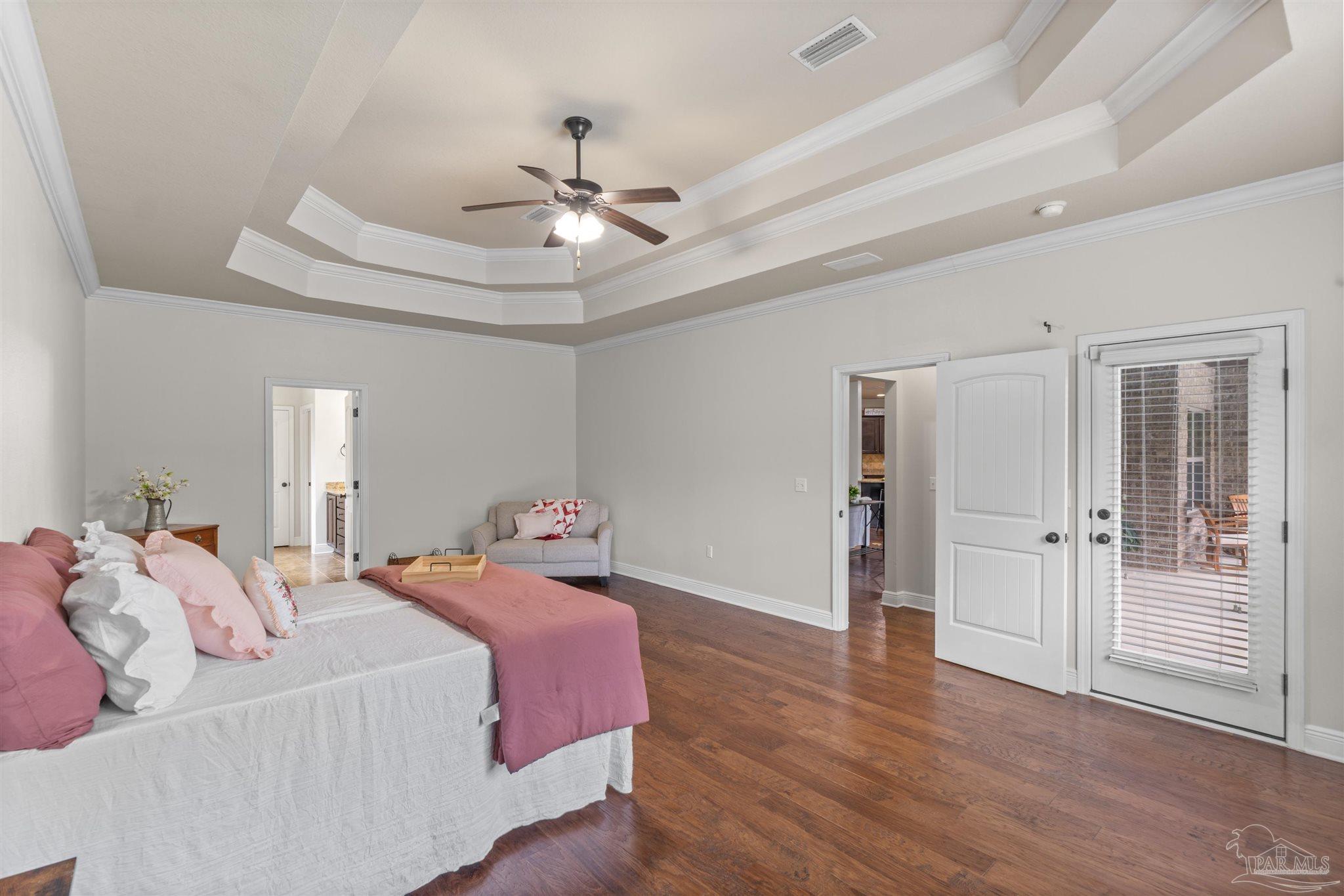 2698 Tulip Hill Road Pace, FL 32571 - Photo 40 of 65 a bedroom with a bed and a ceiling fan