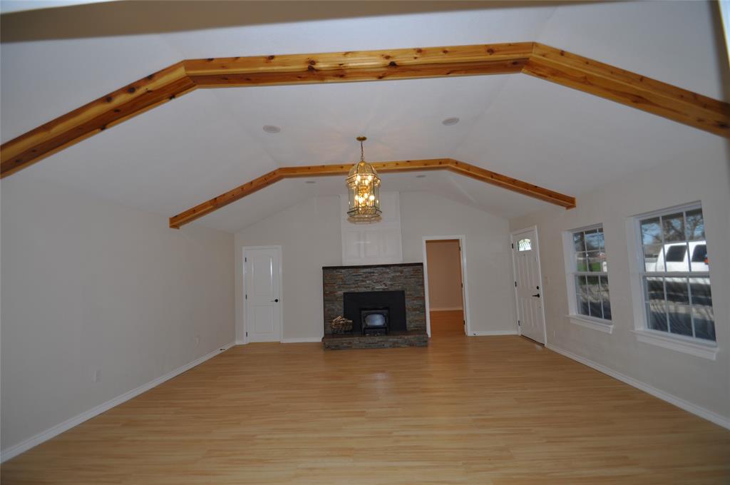 209 West 5th Street Tolar, TX 76476 - Photo 2 of 11 a view of a livingroom with a fireplace