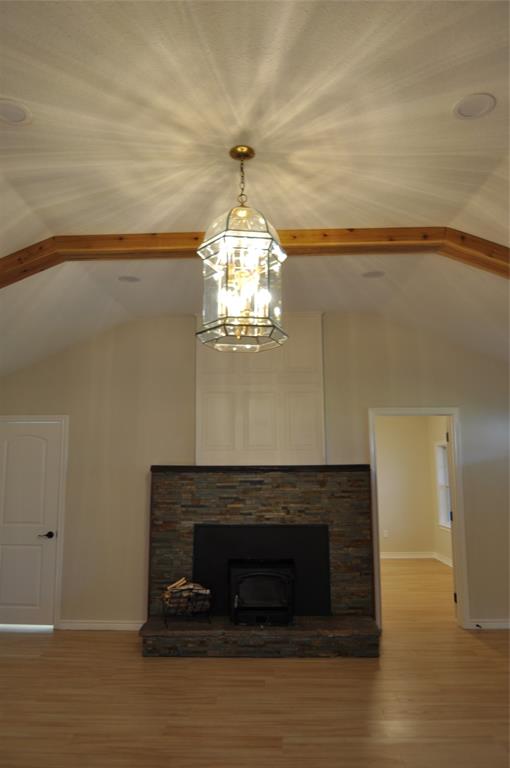 209 West 5th Street Tolar, TX 76476 - Photo 3 of 11 a living room with a fireplace