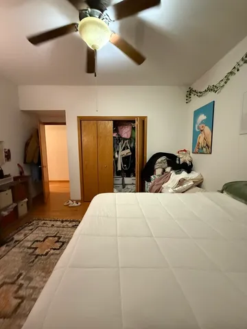 a bedroom with a bed and window