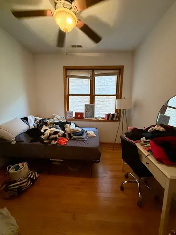 a room with a bed and a chandelier