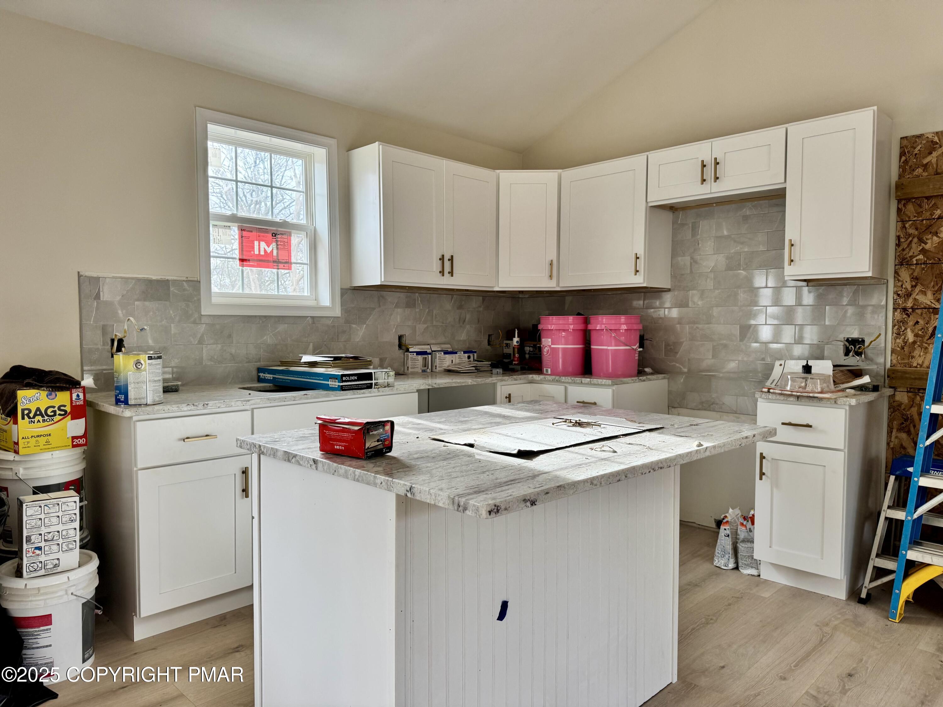 515 Hummingbird Court Bushkill, PA 18324 - Photo 2 of 15 a kitchen with stainless steel appliances granite countertop a sink stove and cabinets