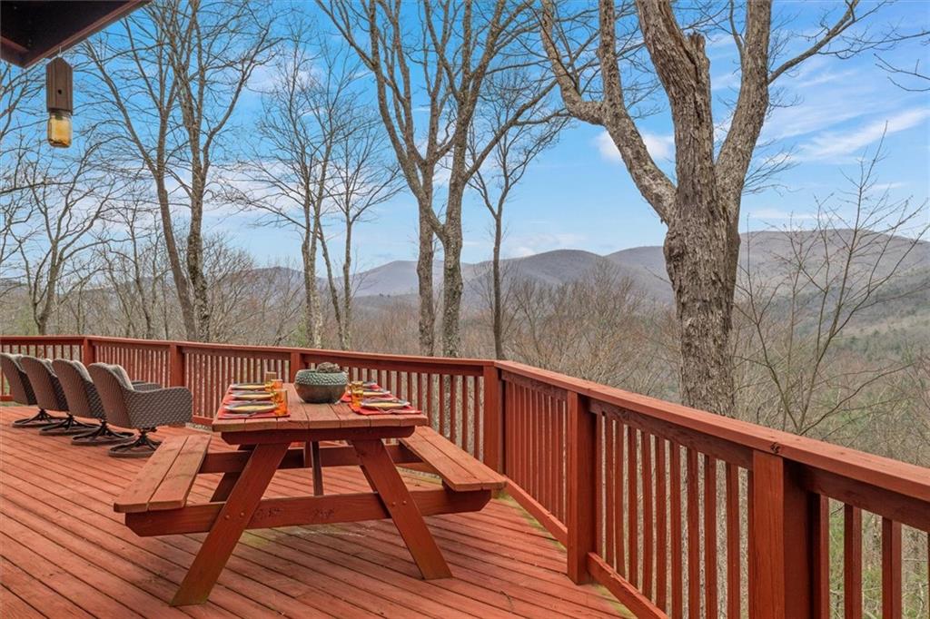 881 Fox Mountain Road Cherry Log, GA 30522 - Photo 14 of 65 a view of balcony with wooden floor and outdoor seating