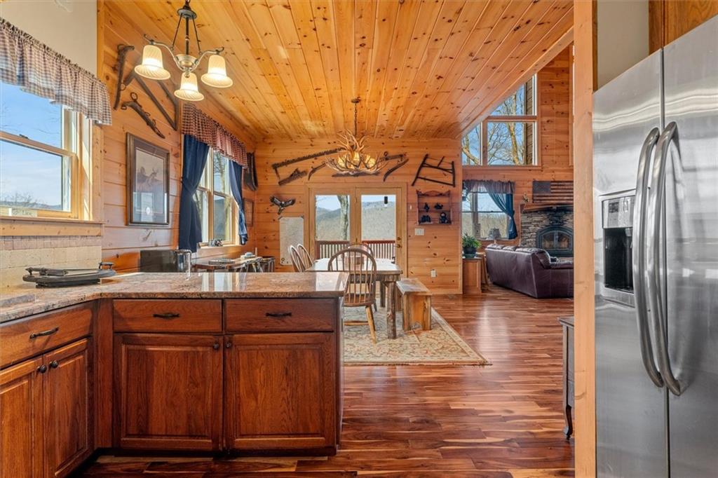881 Fox Mountain Road Cherry Log, GA 30522 - Photo 26 of 65 a kitchen with cabinets and chairs