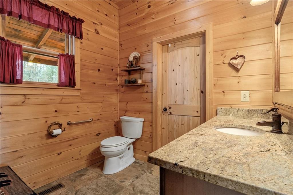 881 Fox Mountain Road Cherry Log, GA 30522 - Photo 36 of 65 a bathroom with a granite countertop sink toilet and shower