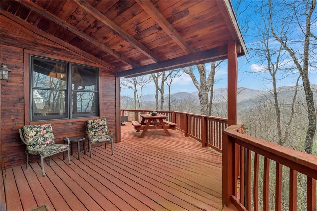 881 Fox Mountain Road Cherry Log, GA 30522 - Photo 39 of 65 a balcony with wooden floor and outdoor seating