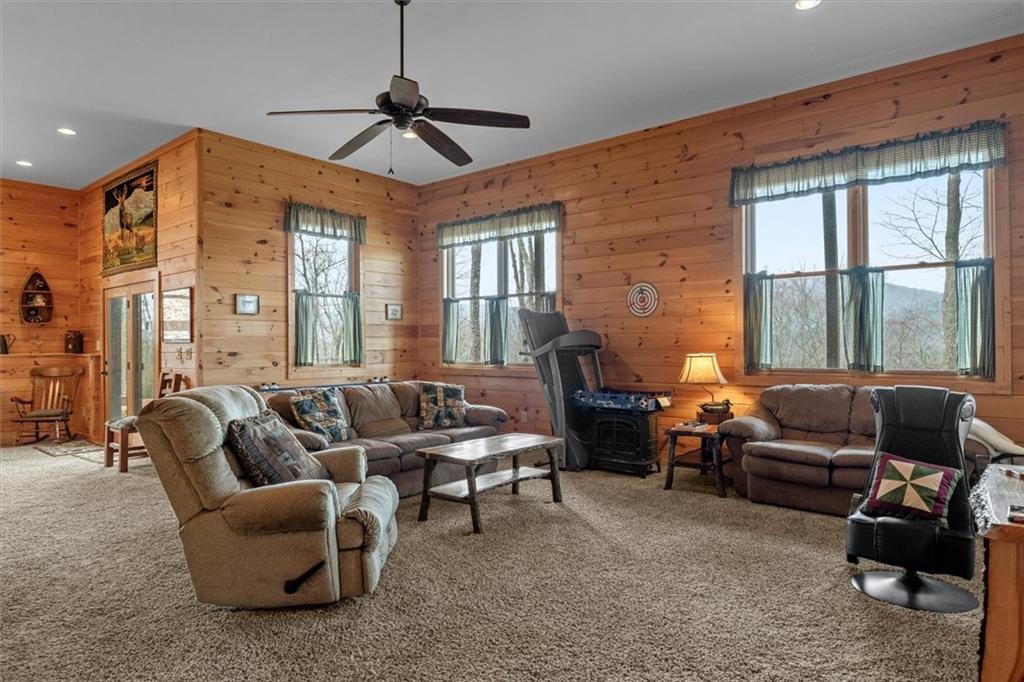 881 Fox Mountain Road Cherry Log, GA 30522 - Photo 52 of 65 a living room with furniture a ceiling fan and a window
