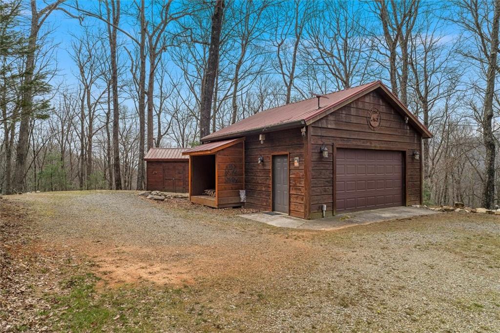 881 Fox Mountain Road Cherry Log, GA 30522 - Photo 63 of 65 a front view of house with yard and trees