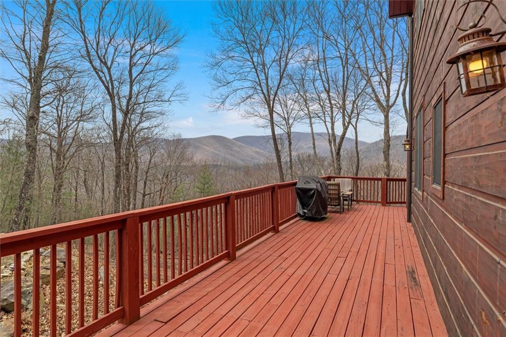 881 Fox Mountain Road Cherry Log, GA 30522 - Photo 10 of 65 a view of balcony with wooden floor and outdoor space