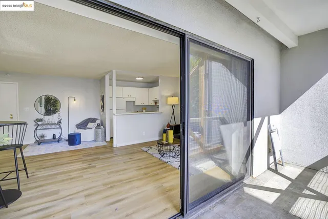 a bedroom with furniture and a large window