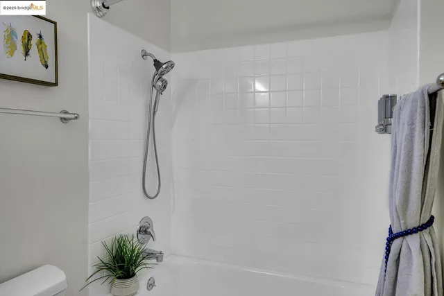 a bathroom with a shower and a shower