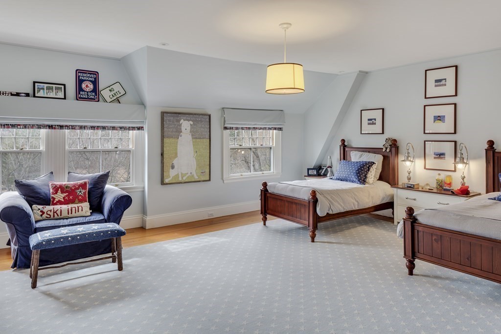 235 Nashawtuc Road Concord, MA 01742 - Photo 15 of 26 a living room with furniture and a potted plant