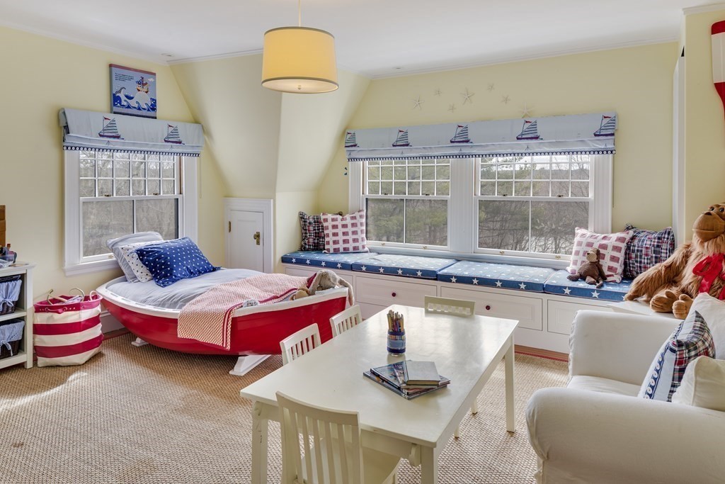 235 Nashawtuc Road Concord, MA 01742 - Photo 18 of 26 a room with furniture and window