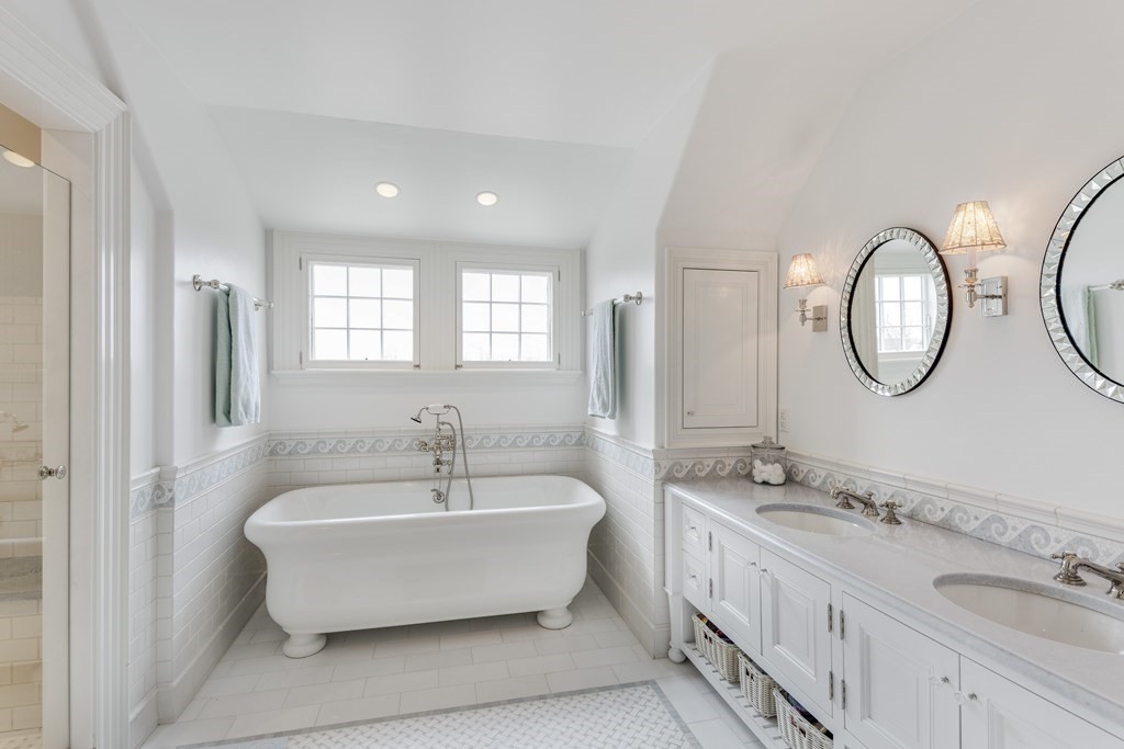 235 Nashawtuc Road Concord, MA 01742 - Photo 20 of 26 a white bath tub sitting next to a bathroom sink