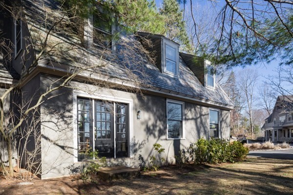 235 Nashawtuc Road Concord, MA 01742 - Photo 25 of 26 a front view of a house with a tree