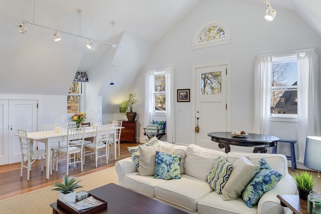 235 Nashawtuc Road Concord, MA 01742 - Photo 26 of 26 a living room with furniture and wooden floor