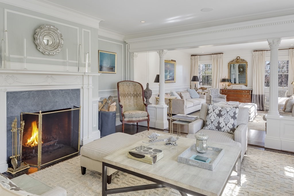 235 Nashawtuc Road Concord, MA 01742 - Photo 3 of 26 a living room with furniture and a fireplace
