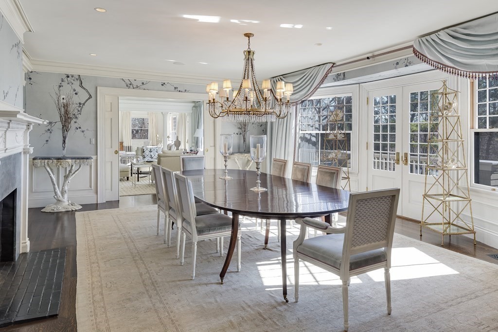 235 Nashawtuc Road Concord, MA 01742 - Photo 6 of 26 a dining room with furniture a chandelier and wooden floor