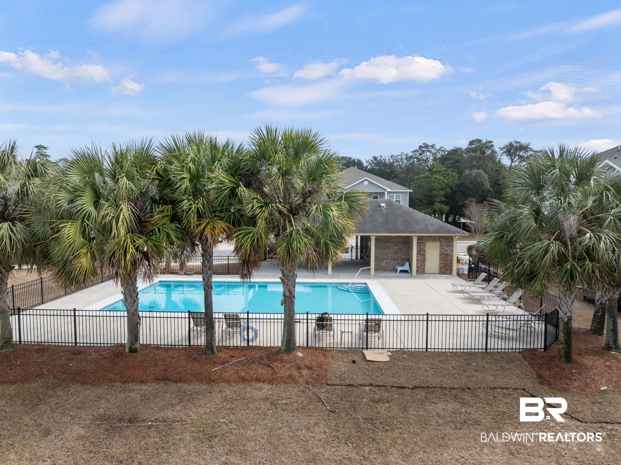 6903 Spaniel Drive, Unit B Spanish Fort, AL 36527 - Photo 27 of 28 Pool with a patio and fence