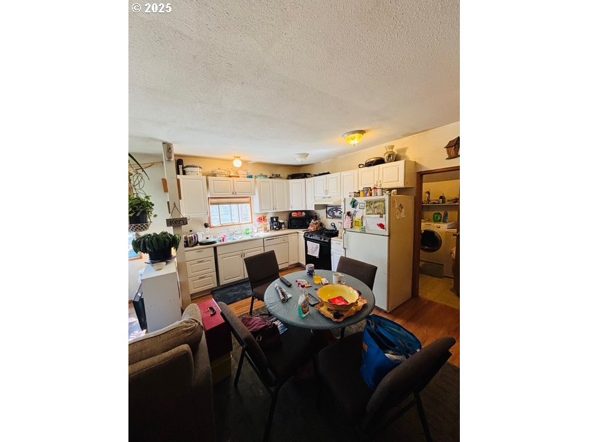 52205 Lechner Lane La Pine, OR 97739 - Photo 8 of 14 a view of a dining room with furniture and a kitchen