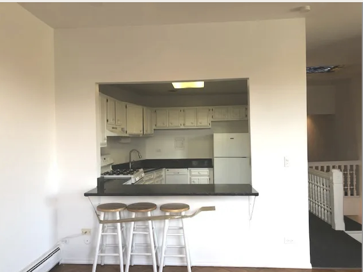 1764 North Clark Street, Unit 3 Chicago, IL 60614 - Photo 3 of 7 a kitchen with a sink and cabinets