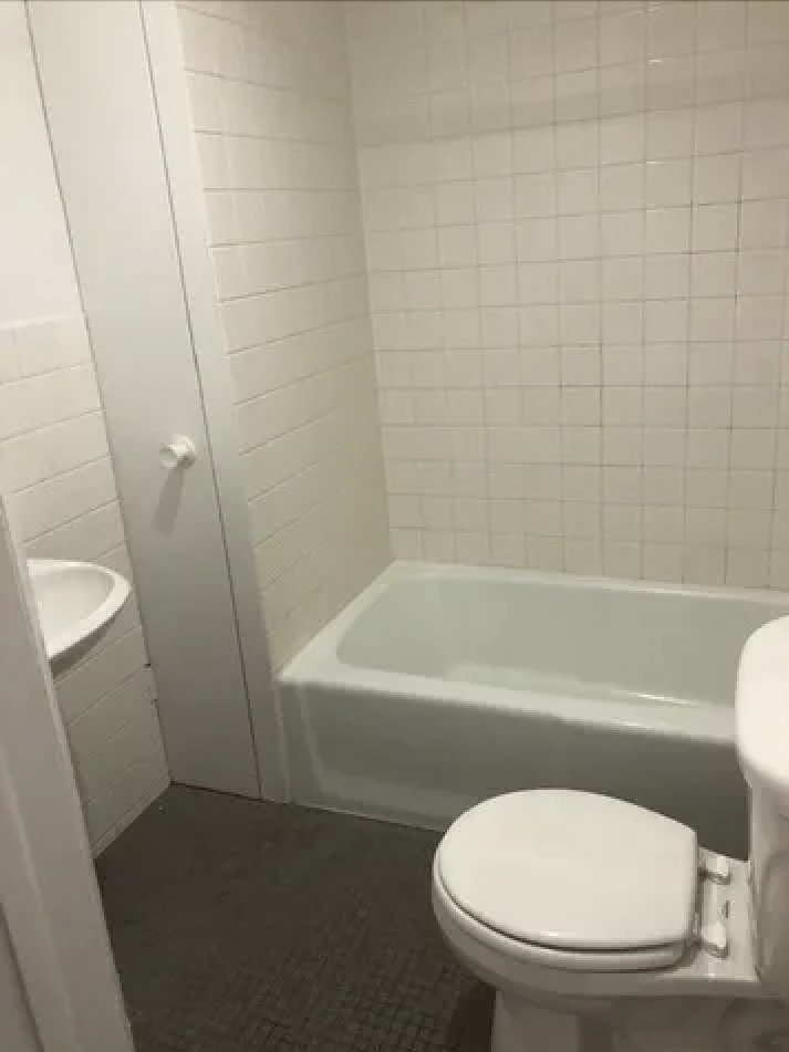 1764 North Clark Street, Unit 3 Chicago, IL 60614 - Photo 7 of 7 a white toilet sitting next to a bath tub