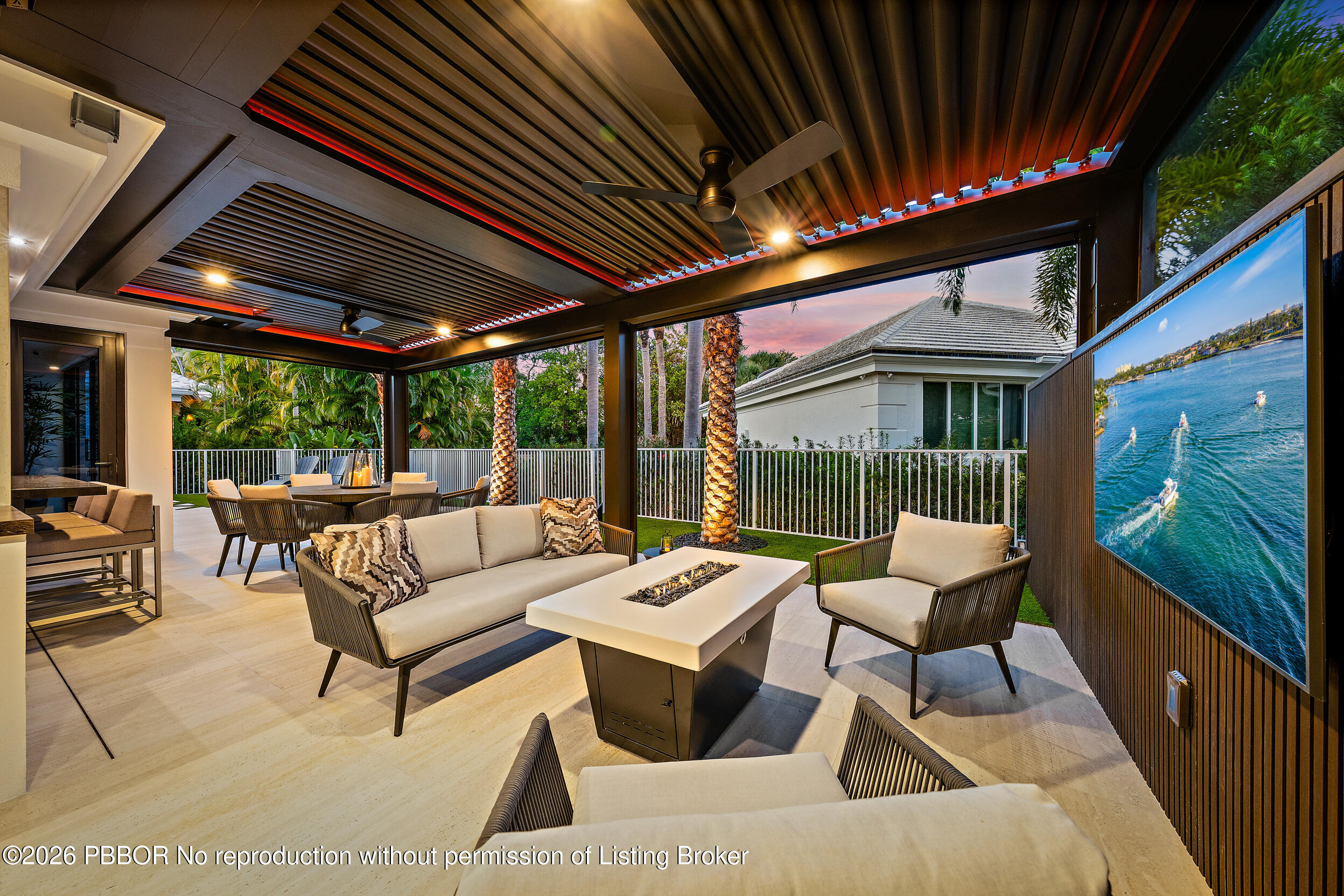 3501 Captains Way, Unit 3501 Jupiter, FL 33477 - Photo 1 of 41 a outdoor space with patio the couches and a fireplace with the potted plants