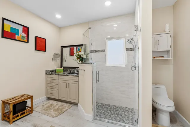 a kitchen with stainless steel appliances a refrigerator and a stove top oven