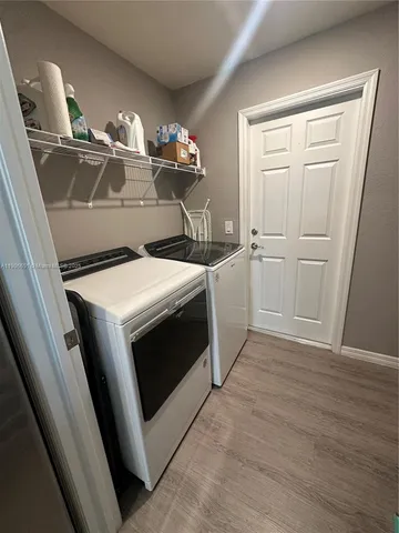 a utility room with dryer and washer
