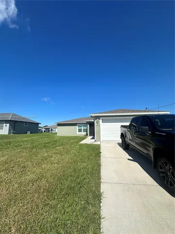 a view of a yard with an outdoor space