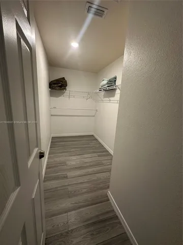 a view of storage and utility room with washer and dryer