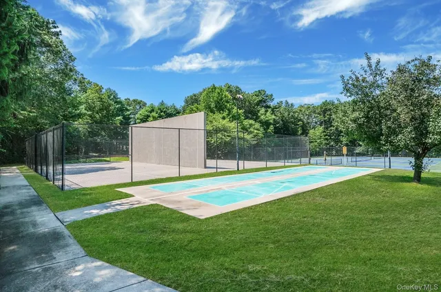 a view of a backyard with swimming pool