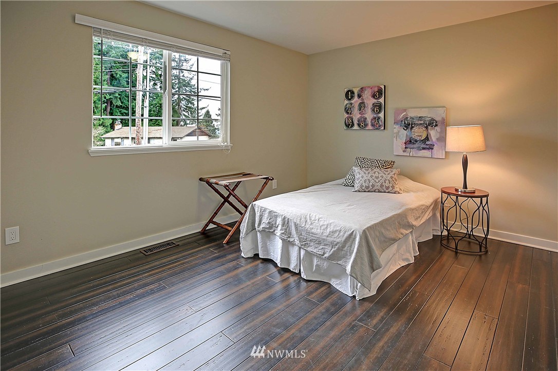 609 213th Street Southwest Bothell, WA 98021 - Photo 14 of 31 a bedroom with a bed and a window