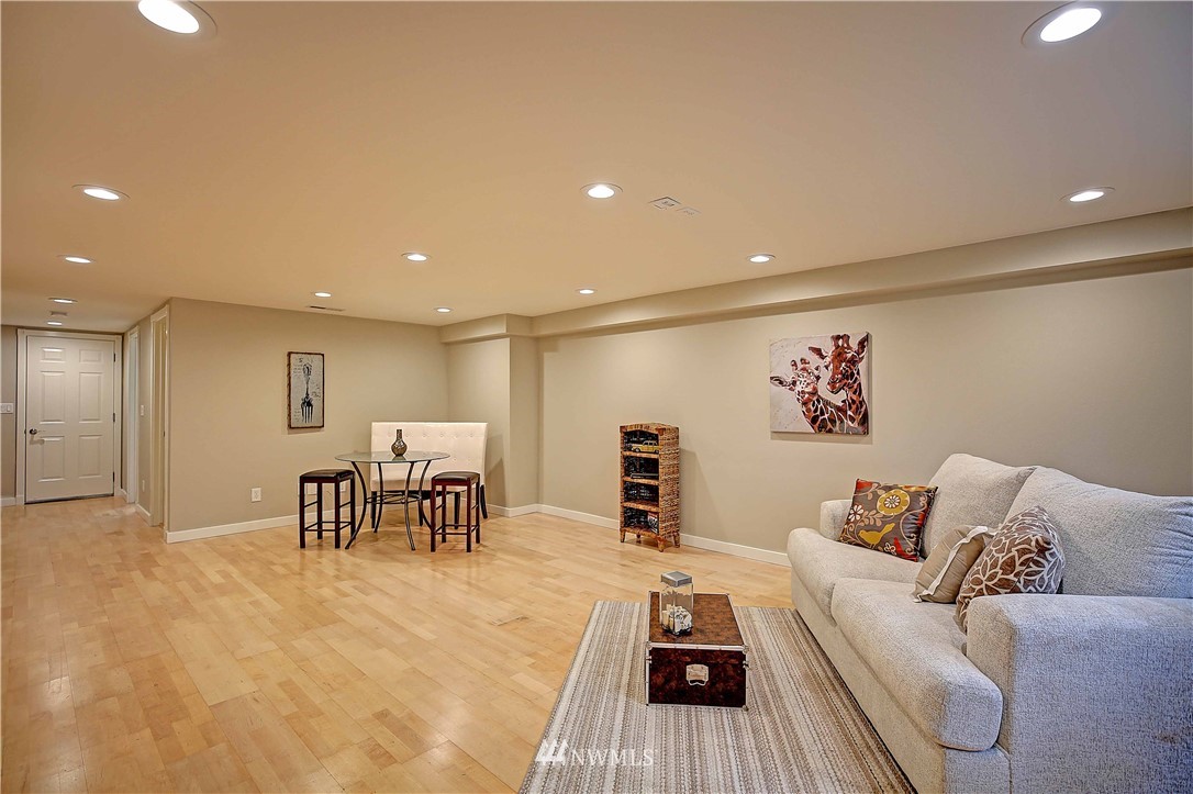 609 213th Street Southwest Bothell, WA 98021 - Photo 19 of 31 a living room with furniture and a table