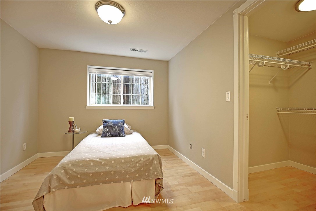 609 213th Street Southwest Bothell, WA 98021 - Photo 20 of 31 a bedroom with a bed and window
