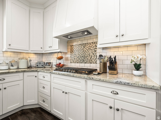 117 Ridge View Drive Elk Ridge, UT 84651 - Photo 9 of 42 Kitchen with white cabinetry, light stone counters, and stainless steel gas stovetop