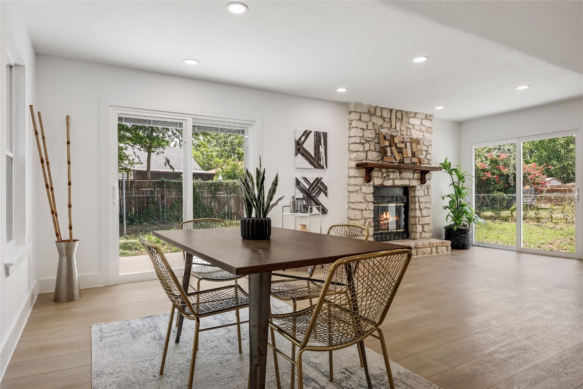 12208 Double Tree Lane Austin, TX 78750 - Photo 13 of 35 a view of a dining room with furniture and a potted plant