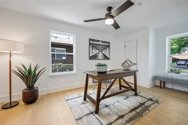 a view of a livingroom with furniture and a window