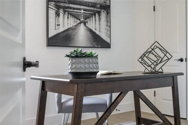 a table with a vase and flowers on it