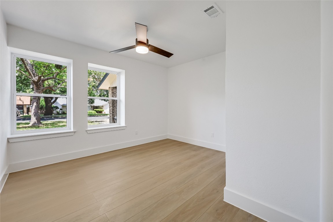 12208 Double Tree Lane Austin, TX 78750 - Photo 26 of 35 an empty room with windows