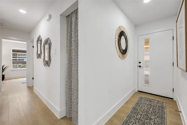 a view of bathroom with a shower and mirror