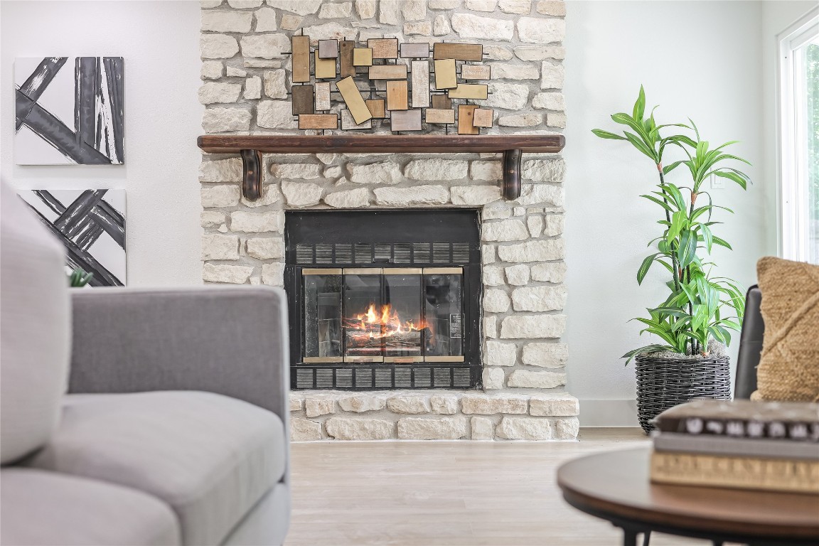 12208 Double Tree Lane Austin, TX 78750 - Photo 9 of 35 a living room with furniture and a fireplace
