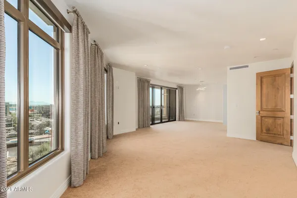 a view of an empty room with a window